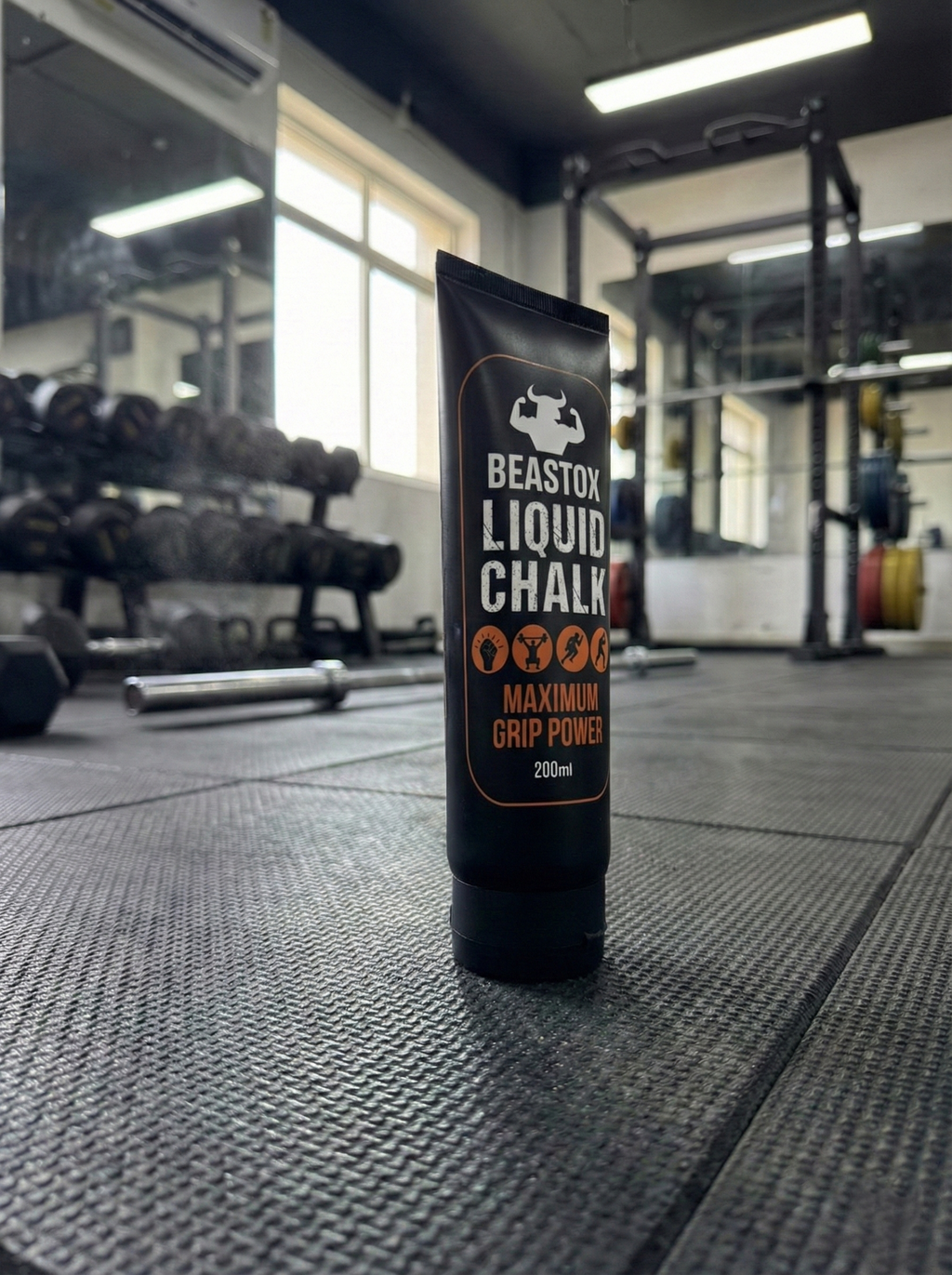 BEASTOX Performance Liquid Chalk - 200ml Tube standing upright on gym floor, emphasizing its use in professional workout environments.